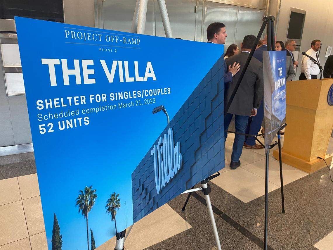 A poster touts the Villa Motel on Parkway Drive that opened Tuesday, March 21, 2023, with 52 units of affordable housing for the homeless, according to officials.