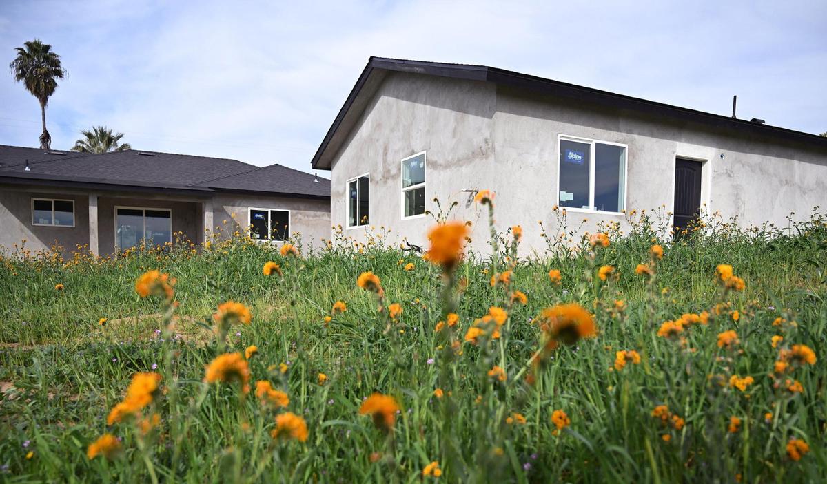 A detached ADU unit, right, is seen behind the main home on a property Friday, Feb. 28, 2025 in Madera County.