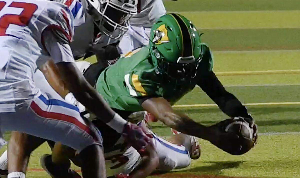 Roosevelt's CJ Barker reaches for the touchdown against Firebaugh at Sunnyside's stadium Friday, Sept. 12, 2025 in Fresno. The Rough Riders pummeled the Eagles 46-6 with Firebaugh scoring their only touchdown in the final minutes of the game.