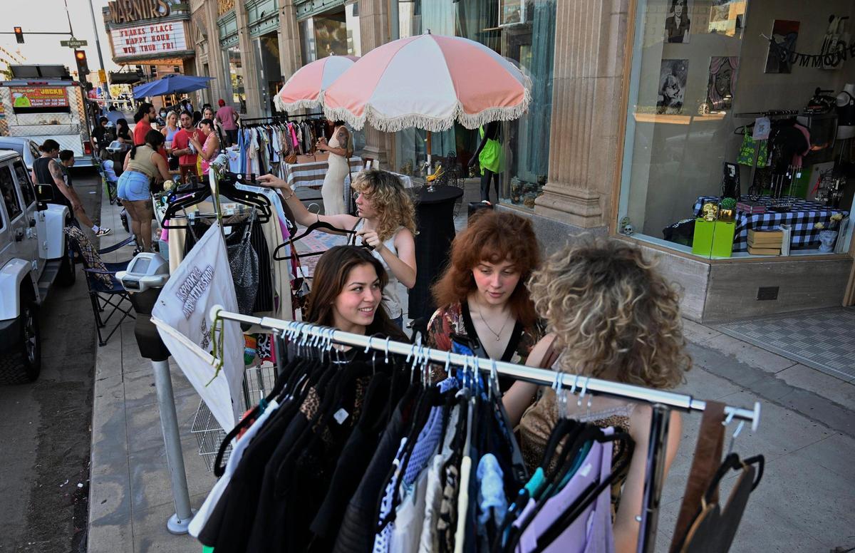 Vendors set up shop with clothing, food and drinks along Tuolumne Street’s sidewalk outside the Warnors Center for the Performing Arts during ArtHop Thursday, Aug. 3, 2023.