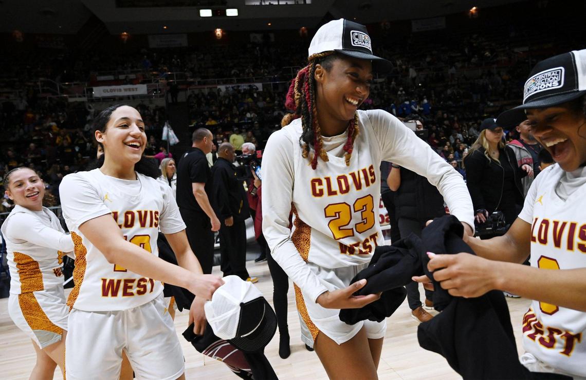 Clovis West celebrates its 54-42 win over Clovis High in the Central Section girls Division I basketball championship Saturday, Feb. 25, 2023 in Fresno.