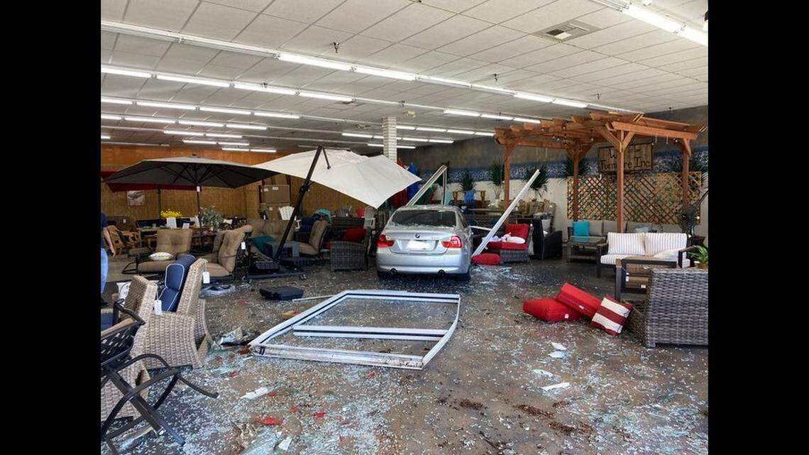 A man drove his BMW through the glass doors of a furniture store in Clovis on Friday, police said. 