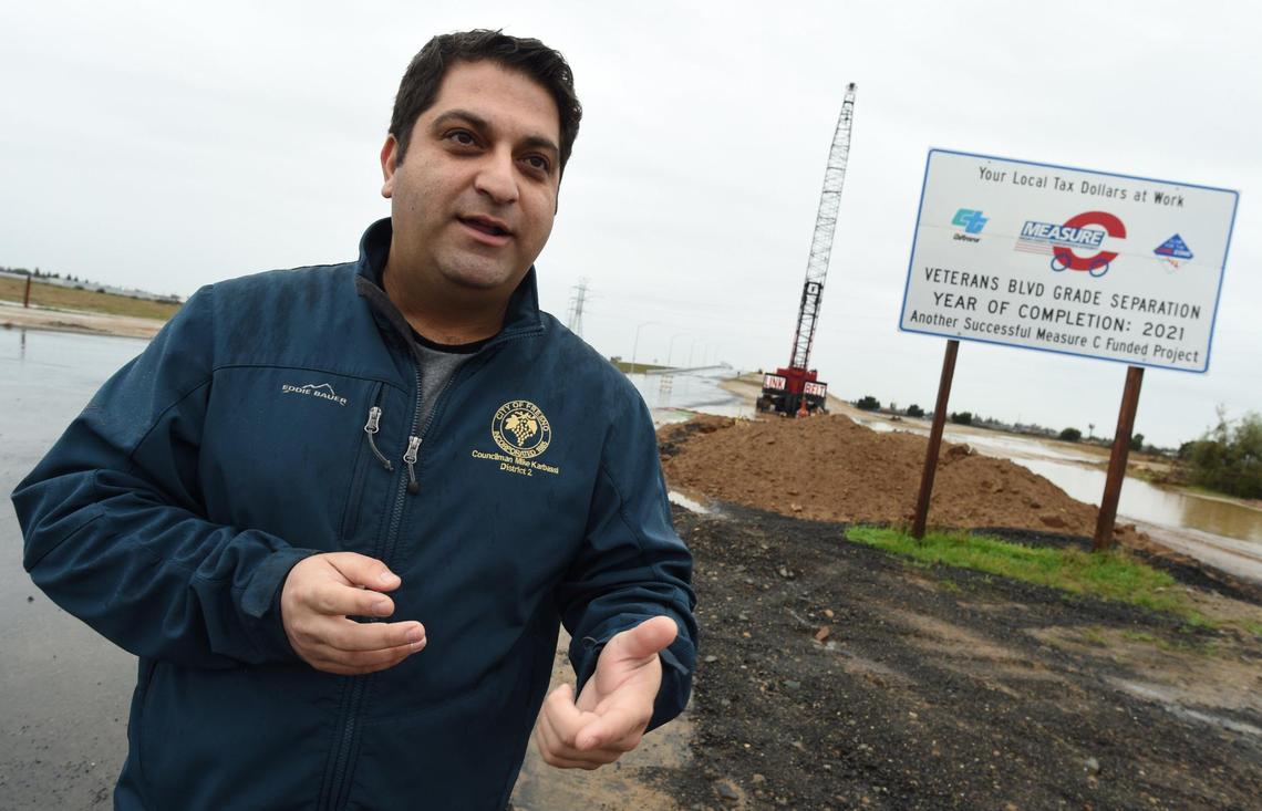 After receiving concerns from constituents about the progress of the Veterans Boulevard project, Fresno City Council Member Mike Karbassi gives an update during a tour of the site’s overpass, Dec. 14, 2021.