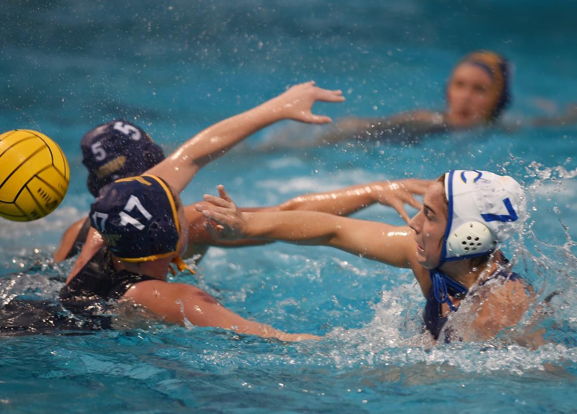 Clovis High’s Isi Sonkoloy, right, takes her shot against Arroyo Grande at the Division I water polo championships held at Fresno State Saturday, Nov. 10, 2018 in Fresno. Clovis High won 6-5.