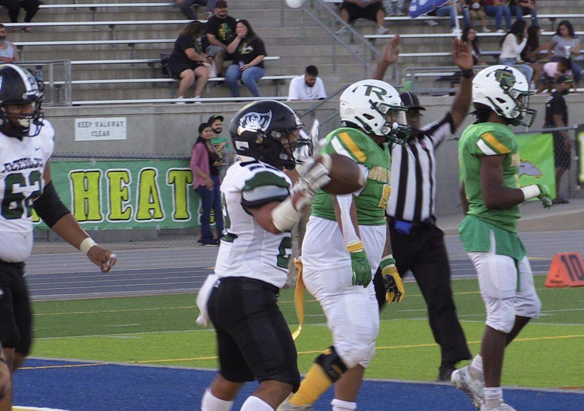 Reedley running back Zach Lampa scores a rushing touchdown in the Pirates’ 26-16 victory over Roosevelt at Sunnyside Stadium in Fresno on Thursday, Aug. 25, 2022.