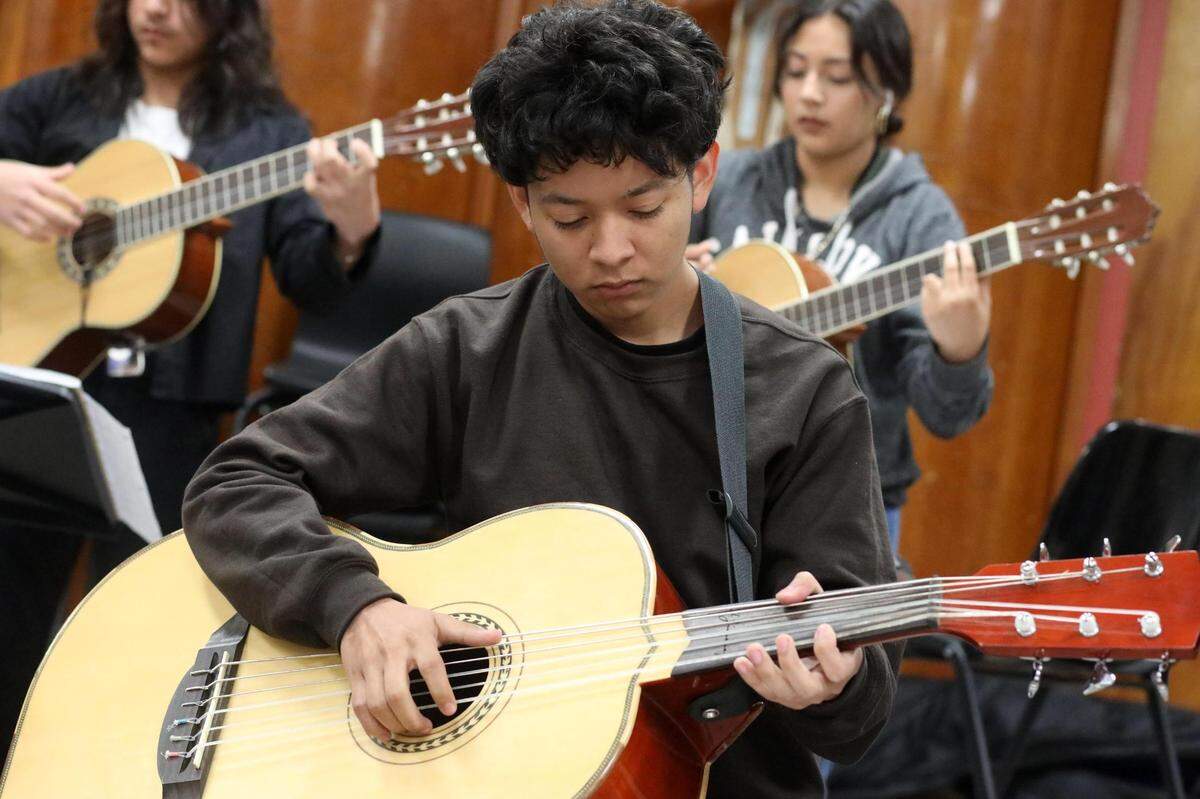 Orosi High School Mariachi Cardenal members during the mariachi class on Wednesday, March 15, 2023.