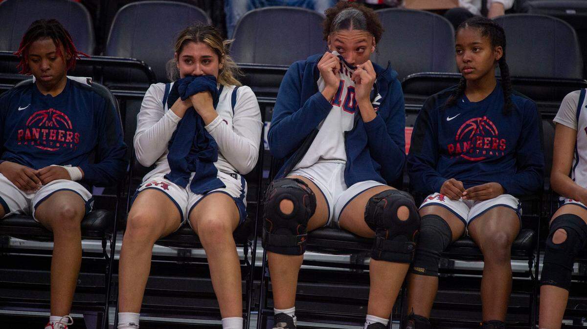 San Joaquin Memorial’s Asha Sra, second from left, and Alexis Swillis, second from right, react to their loss against Sage Hill during the CIF State Division II basketball championship game on Saturday, March 12, 2022, at Golden 1 Center in Sacramento.