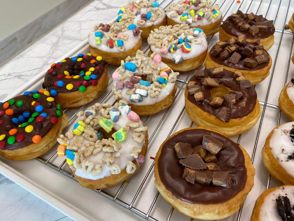 Specialty donuts with toppings like peanut butter cups, Oreos and M&Ms are popular at Liv’s Donuts’ new location.