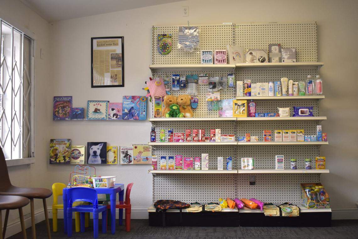 The shelves on a wall at Coarsegold’s Yosemite Drug, a community pharmacy, hold over-the-counter medications and children’s books Friday, Feb. 21, 2025.