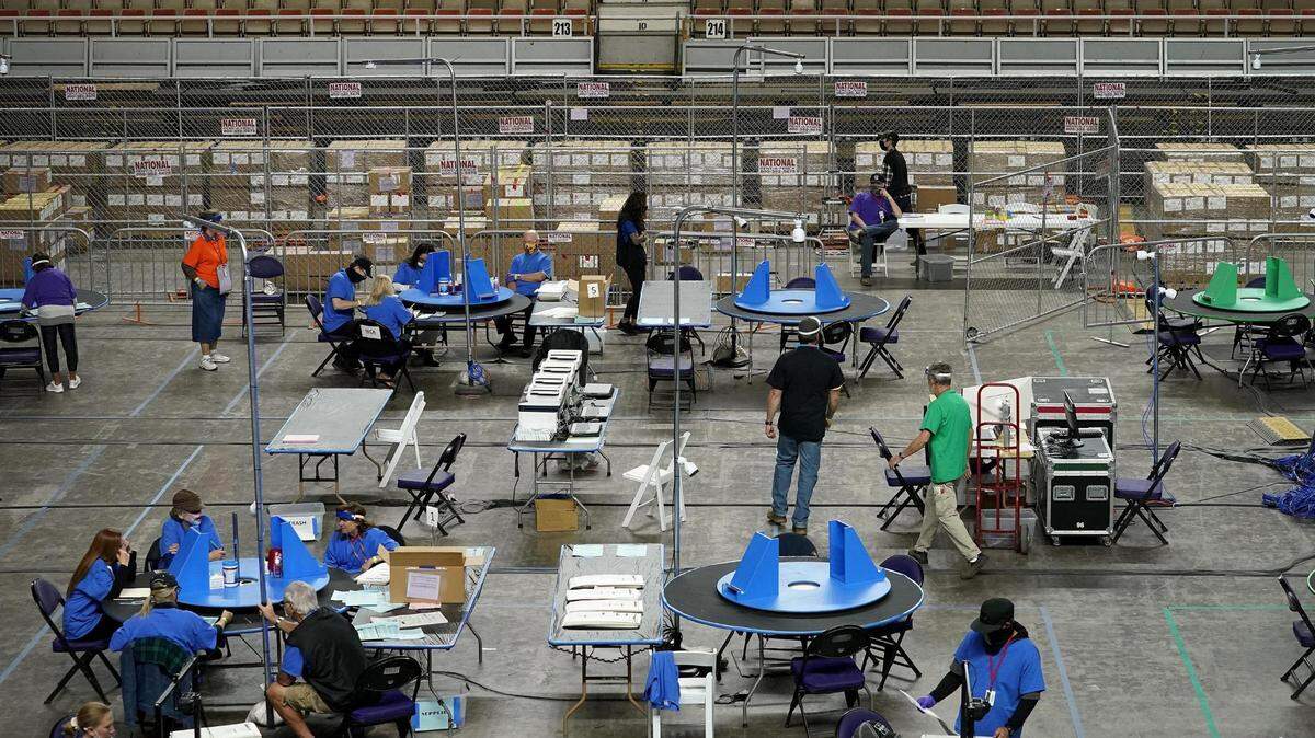 Auditors reviewing the ballots cast last November in Maricopa County, Arizona.