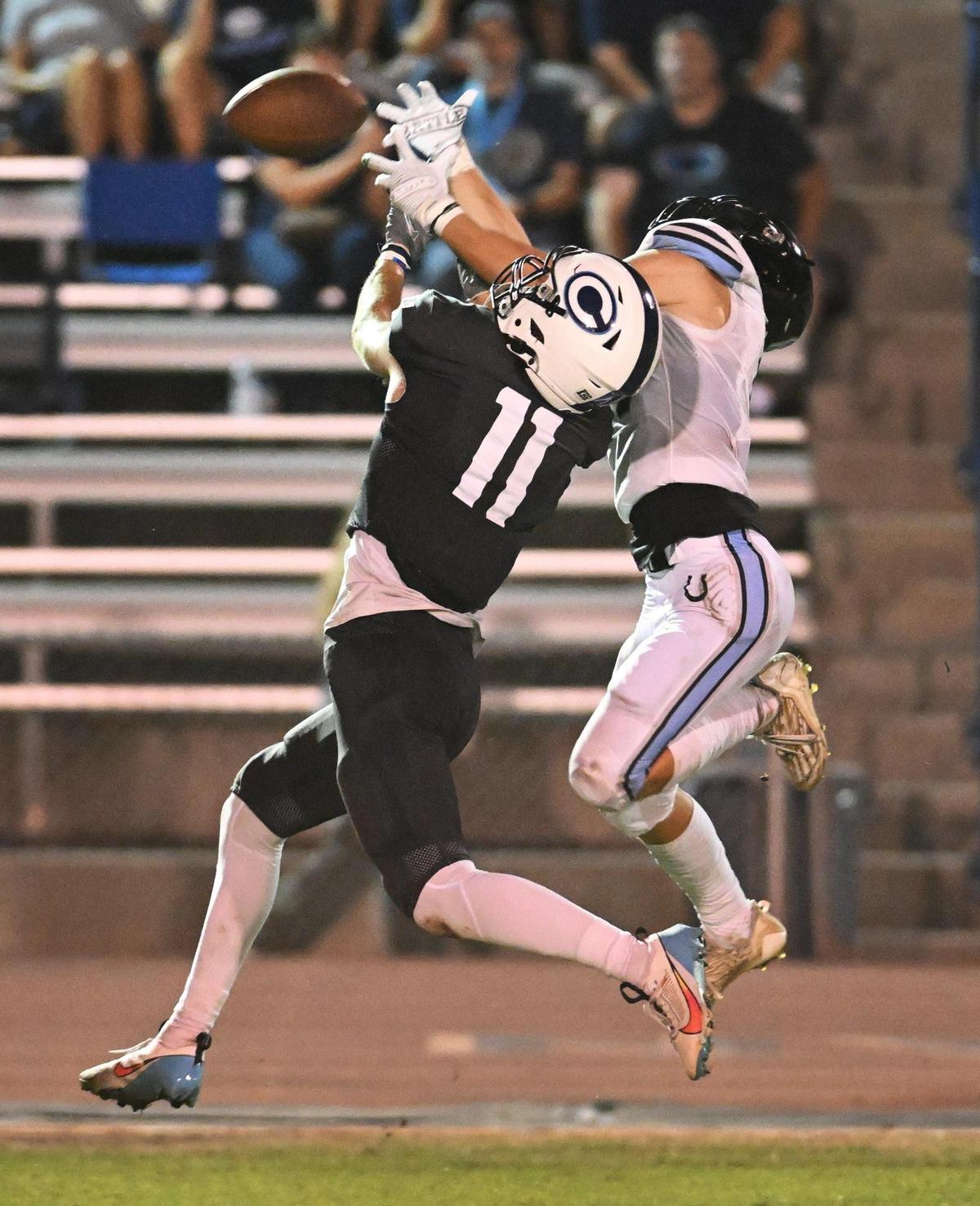 Central Valley Christian’s Gunnar Piepgrass, left, can’t come down with the ball on a long pass defended by Clovis North’s Brody Cardenas during their game at CVC on Friday, Sept. 8, 2023. Cardenas was called for pass interference on the play.