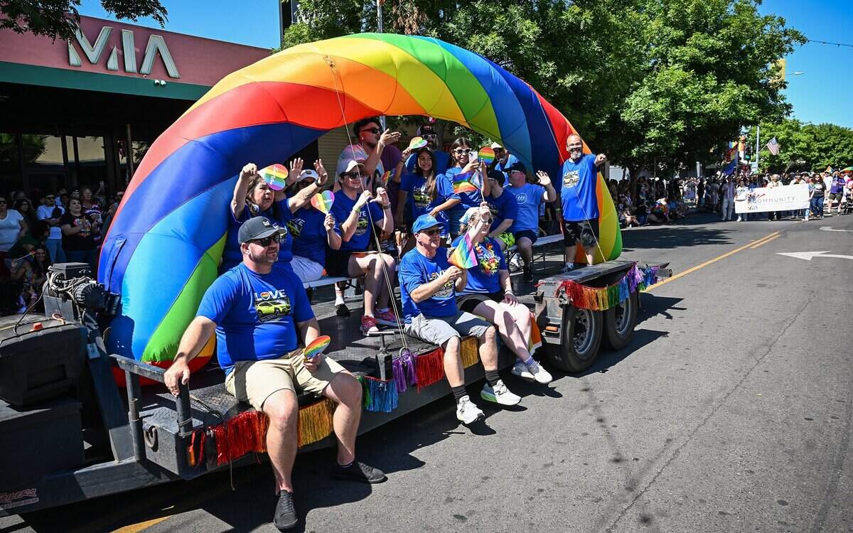 Parade participants ride the Lithia Motors rainbow float during the annual Fresno Rainbow Pride Parade and Festival in the Tower District on Saturday, June 6, 2026.