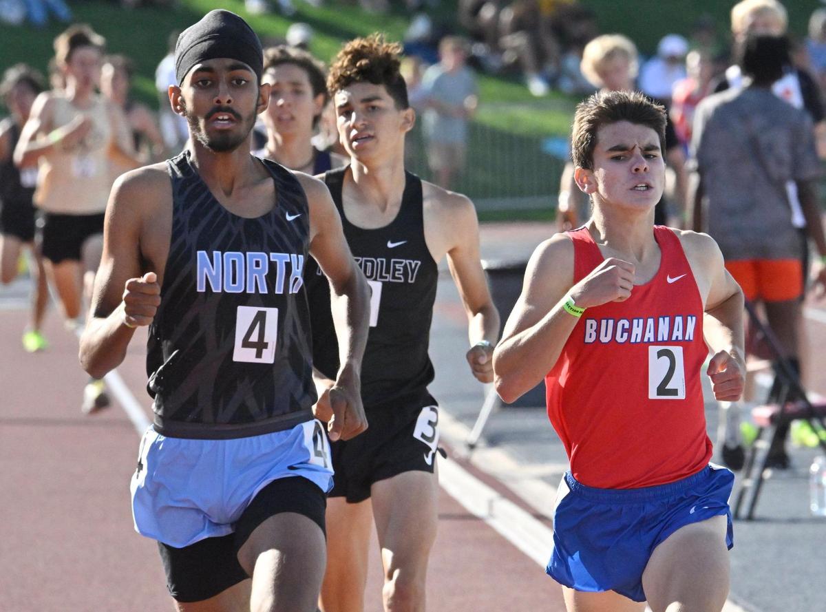Clovis North’s Teg Pandher, left, comes from behind to place first, edging out Buchanan’s Luke Sanders in second for the 1600 at the CIF Central Section Masters track and field meet, held at Veterans Memorial Stadium on Saturday, May 20, 2023 in Clovis.