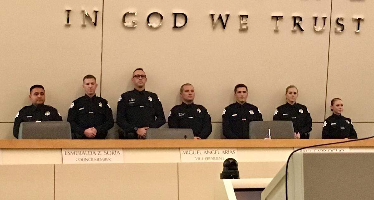 Recipients of the Fresno Police Department’s Lifesaving with Valor Medal await the presentation of their awards at Fresno City Hall on Dec. 19, 2019.