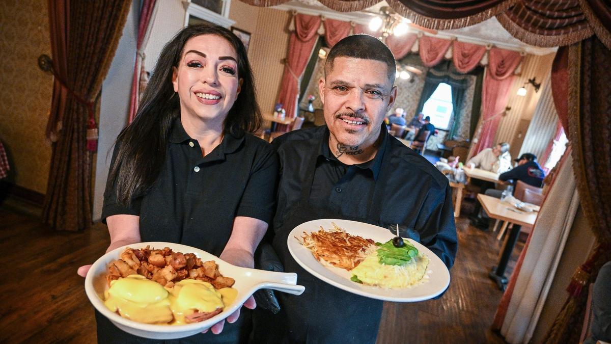 Ruby and Armando Martinez hold up eggs Benedict and omelet plates at their restaurant, Jeb’s Blueberry Hill, at its new location in the historic Hoblitt Hotel in Old Town Clovis. The couple had been running the restaurant in a rough part of Fresno at Blackstone and Dakota avenues when they got the opportunity to move to a safer place.