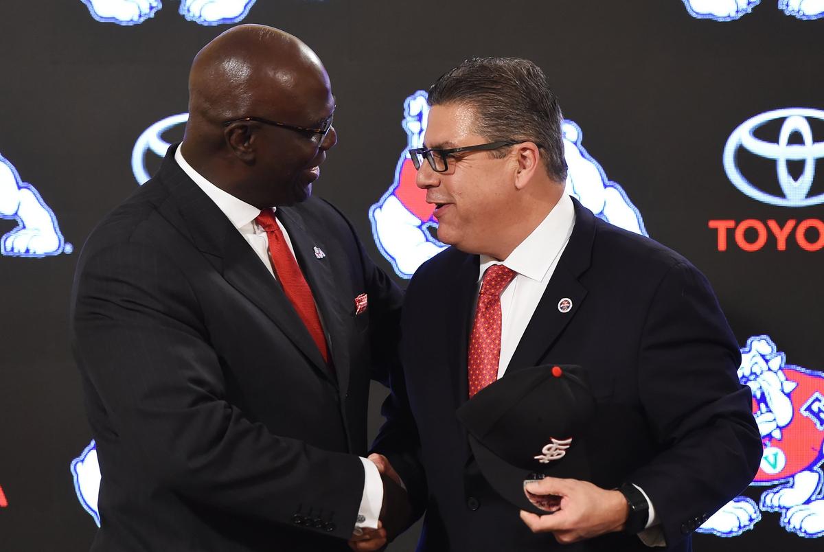 Terry Tumey, left, is welcomed by Fresno State President Joseph Castro at a press conference announcing Tumey’s hiring as Bulldogs athletics director on Monday, June 25, 2018 in Fresno. Tumey is focused on getting Pac-12 and Power Five opponents to come to Bulldog Stadium.