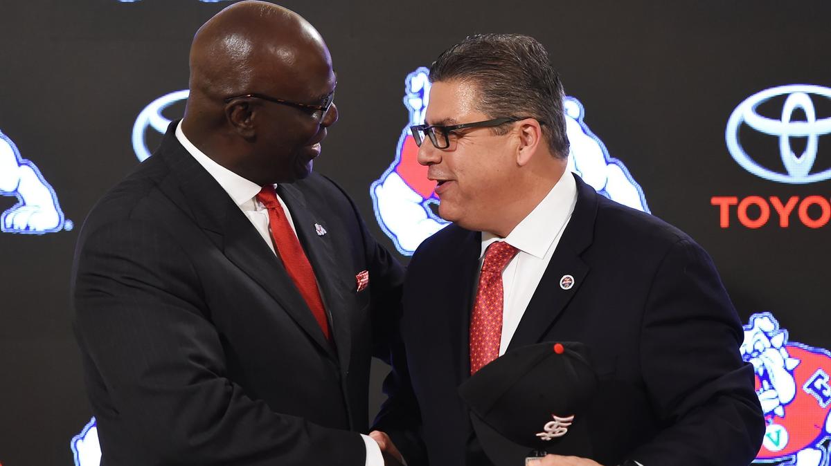 Terry Tumey, left, is welcomed by Fresno State President Joseph Castro at a press conference announcing Tumey’s hiring as Bulldogs athletics director on Monday, June 25, 2018 in Fresno. Tumey is focused on getting Pac-12 and Power Five opponents to come to Bulldog Stadium.