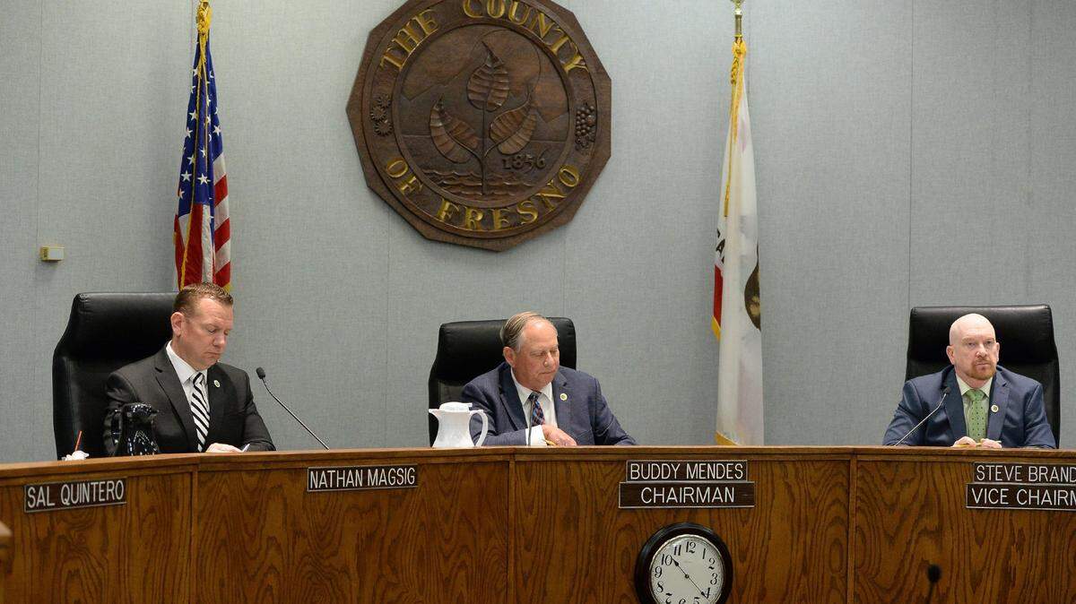 Fresno County supervisors Nathan Magsig, from left, Buddy Mendes and Steve Brandau sit in on a Fresno County Board of Supervisors meeting.