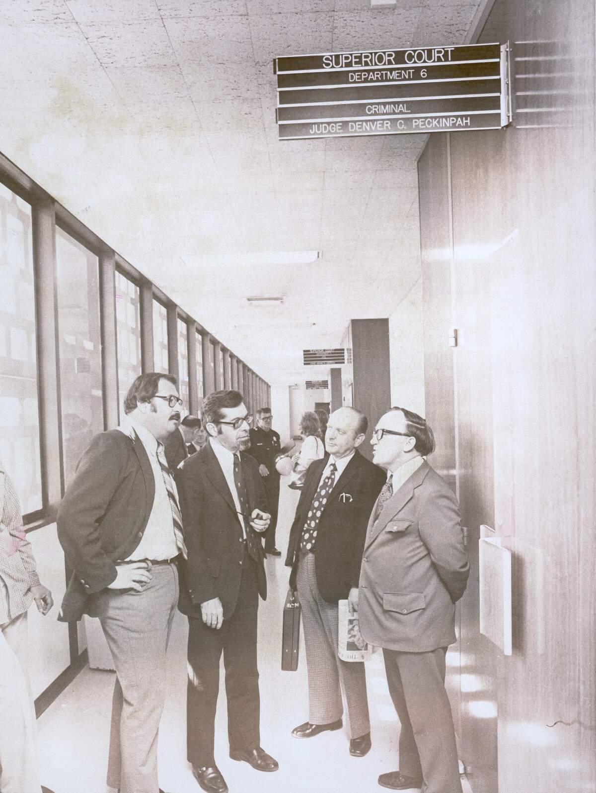 The Fresno Bee Four, from left, Joe Rosato, James Bort Jr., George Gruner and William Patterson, discuss their appeal outside Superior Court Judge Denver C. Peckinpah’s courtroom on April 24, 1975 after being sentenced to indefinite jail terms for refusing to reveal the source of a sealed Grand Jury testimony.