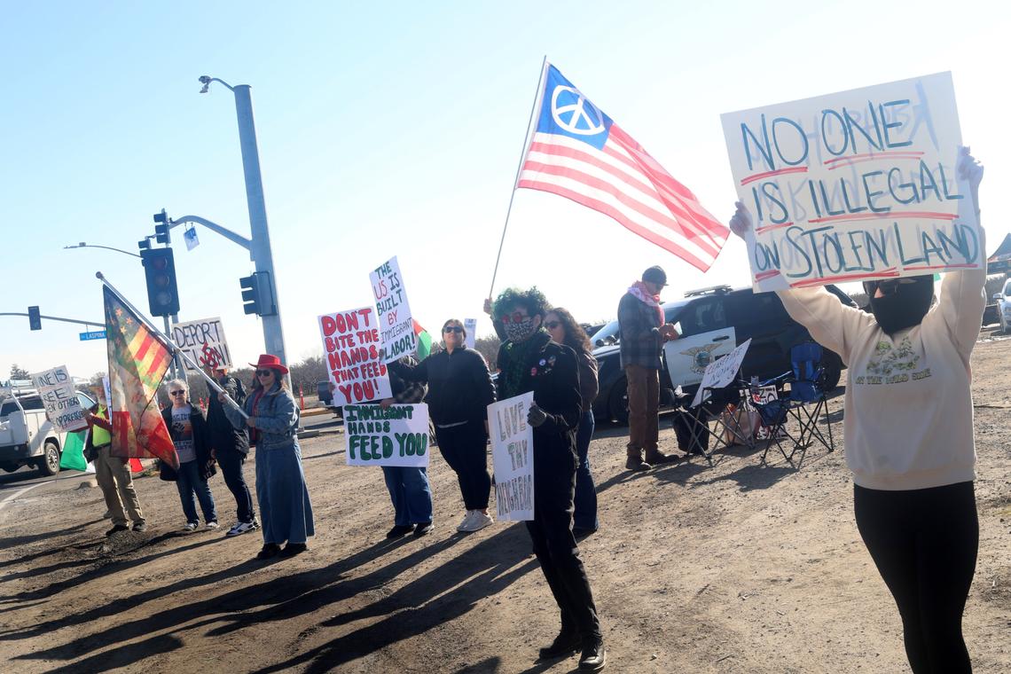 A couple of dozen people holding banners that read ‘Stop Deporting Workers” or “End Harmful Immigration detention policies” showed up to support immigrant farmworkers at the corner of South Laspina Street and East Paige Avenue as Ag show attendees drove by to the annual World Ag Expo on Tuesday.