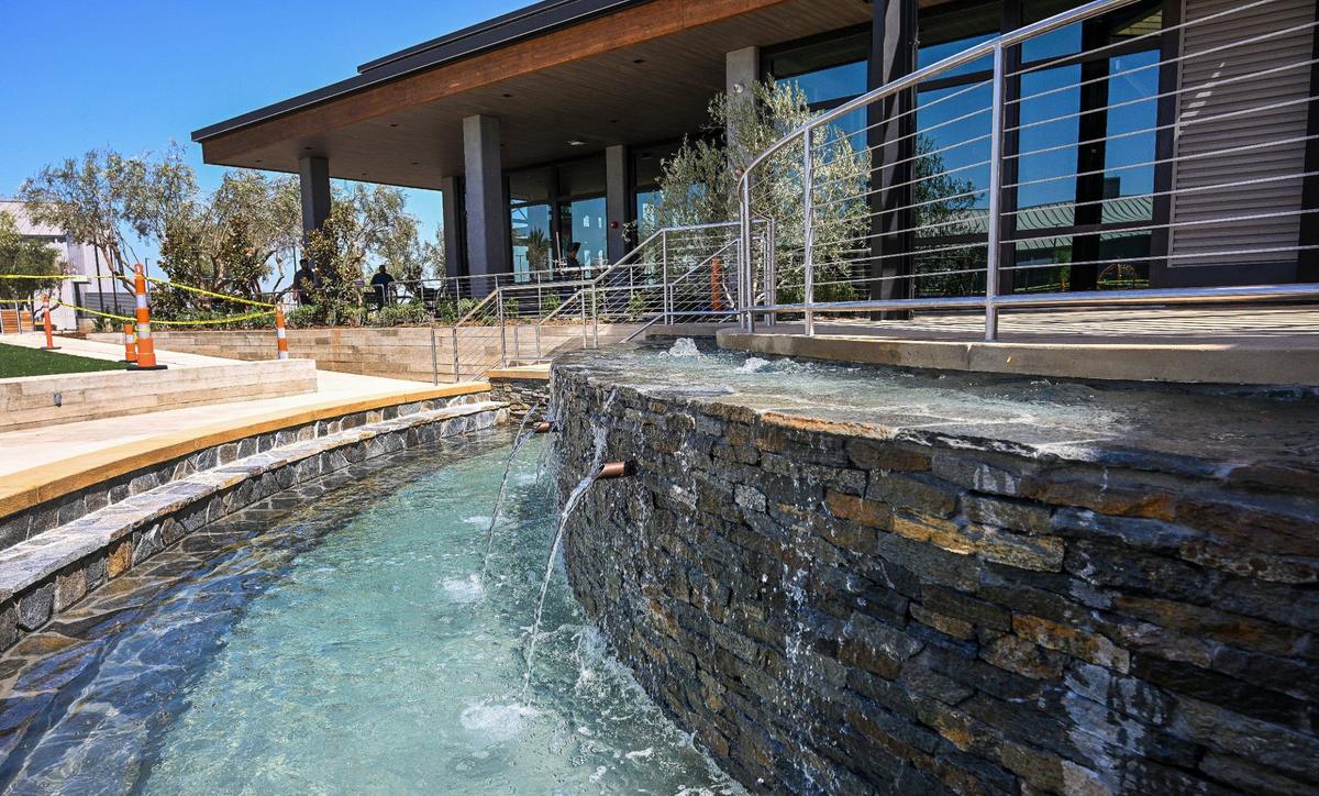 A large baptismal fountain at the center of The Well Community Church’s Clovis campus allows for viewing by large groups with an amphitheater and large outdoor video screen above.