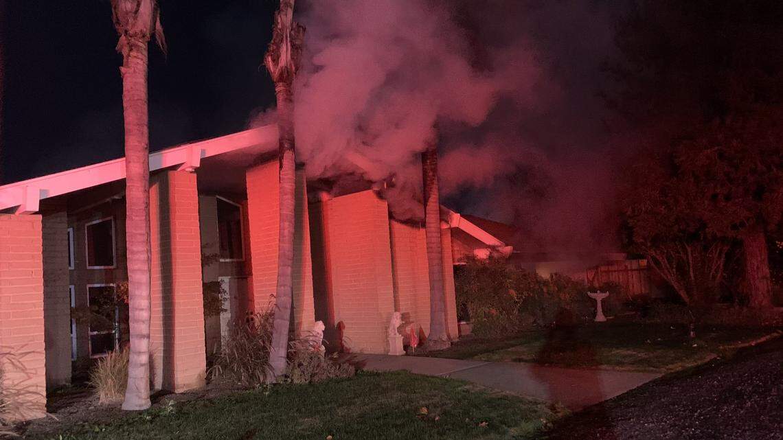 A woman suffered major burns and a family with five children due to a fire that scorched the majority of a large house just outside of the city of Fresno.