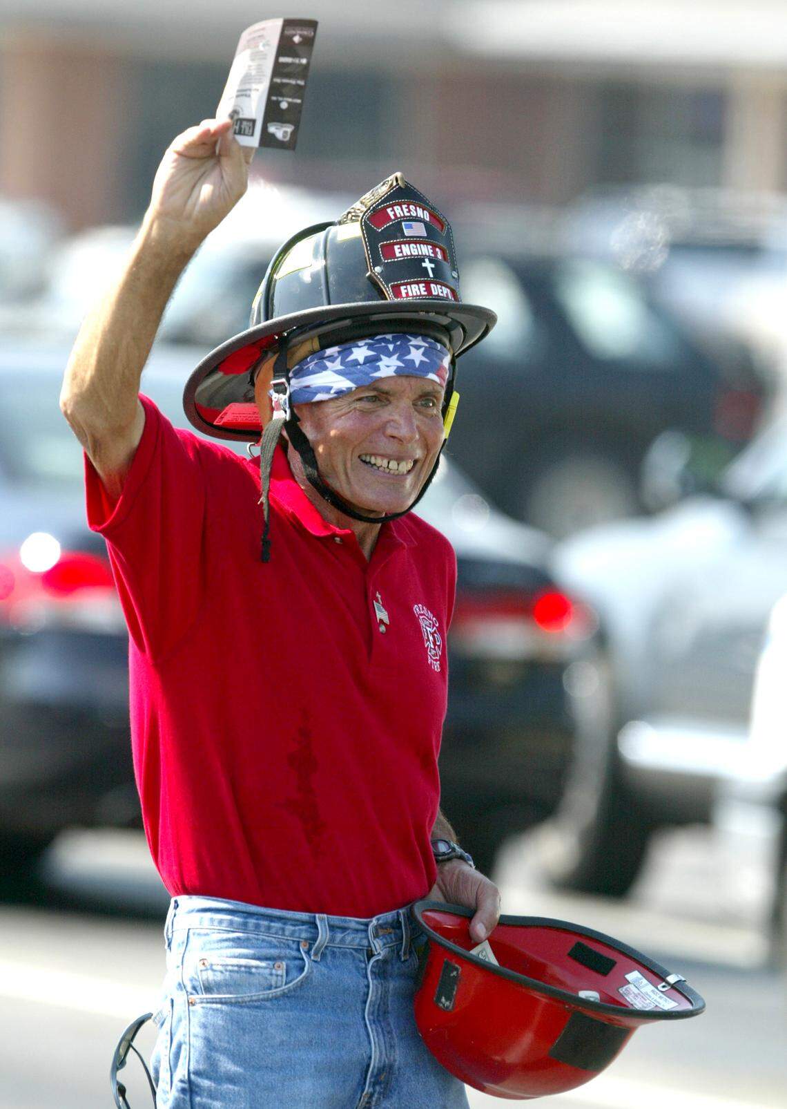 Mickey Kaitangian at age 71 in 2006 collecting donations during a “Fill the Helmet” fundraiser for Community Regional Medical Center’s burn center.