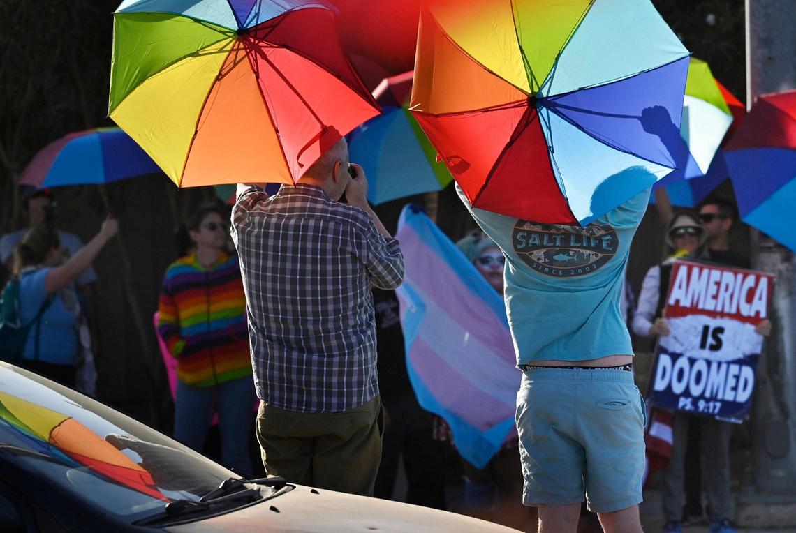 A coalition of LGBTQ+ organizations and supporters, headed by LGBT+ Fresno, held a counter-protest outside Roosevelt Hgh School featuring rainbow-themed umbrellas as symbolic shields against a group from Westboro Baptist Church, a member of which can be seen at bottom lower right corner in the background Monday, Oct. 28, 2024, Fresno.