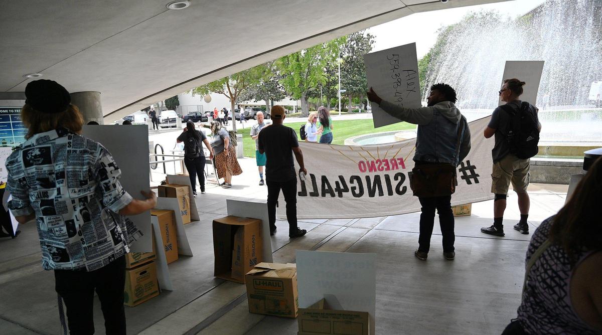A group of protesters unhappy with the city’s plans gather outside Fresno City Hall before the start of a special council meeting for presentations of the City of Fresno’s housing plans in answer to the housing crises Wednesday, April 27, 2022 in Fresno.