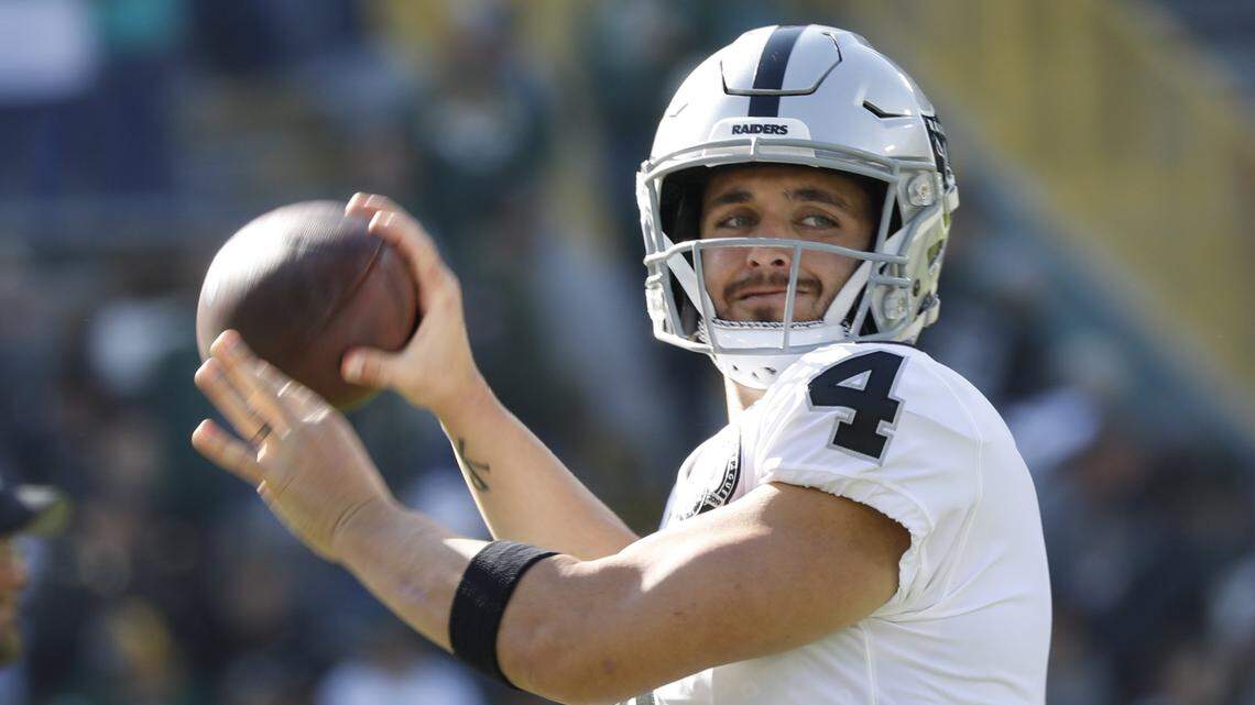 Oakland Raiders’ Derek Carr warms up before an NFL football game against the Green Bay Packers Sunday, Oct. 20, 2019, in Green Bay, Wis.