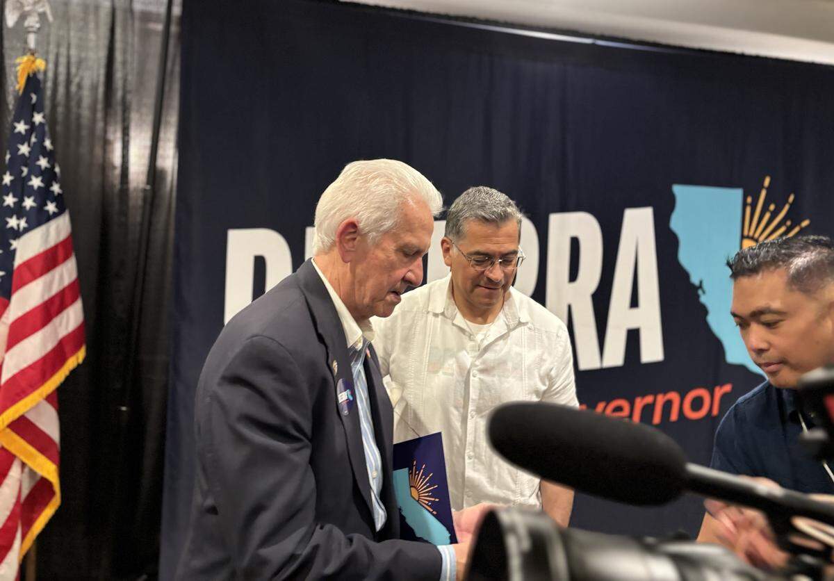 Rep. Jim Costa (D-Fresno) prepares to take a photo with Xavier Becerra at a gubernatorial campaign rally at the Doubletree Hilton in downtown Fresno on Saturday May 23, 2026.