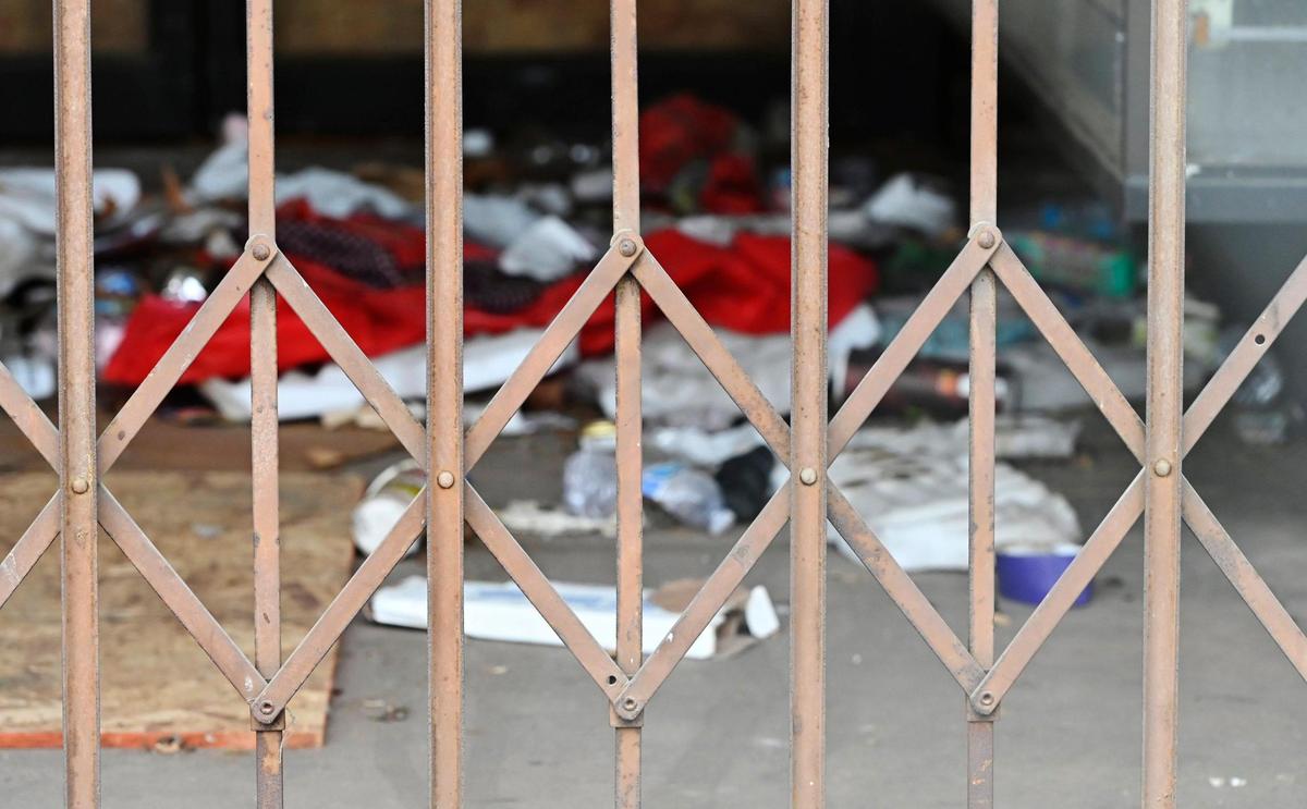 Trash is seen strewn within one of the unique archways of the Fink & Skopp building located along Van Ness Avenue near Tulare St., shown Friday, Jan. 19, 2024 in downtown Fresno.