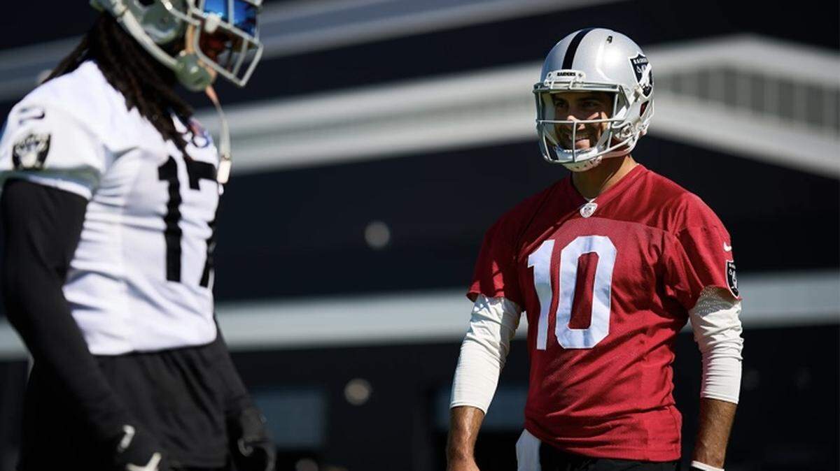Las Vegas Raiders’ Jimmy Garoppolo and Davante Adams during the first week of training camp.