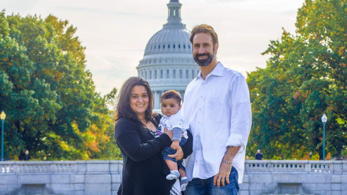 Michael and Sahar Robertson with their son, Wali, in front of the nation’s capital on Nov. 4, 2017, his birthday.