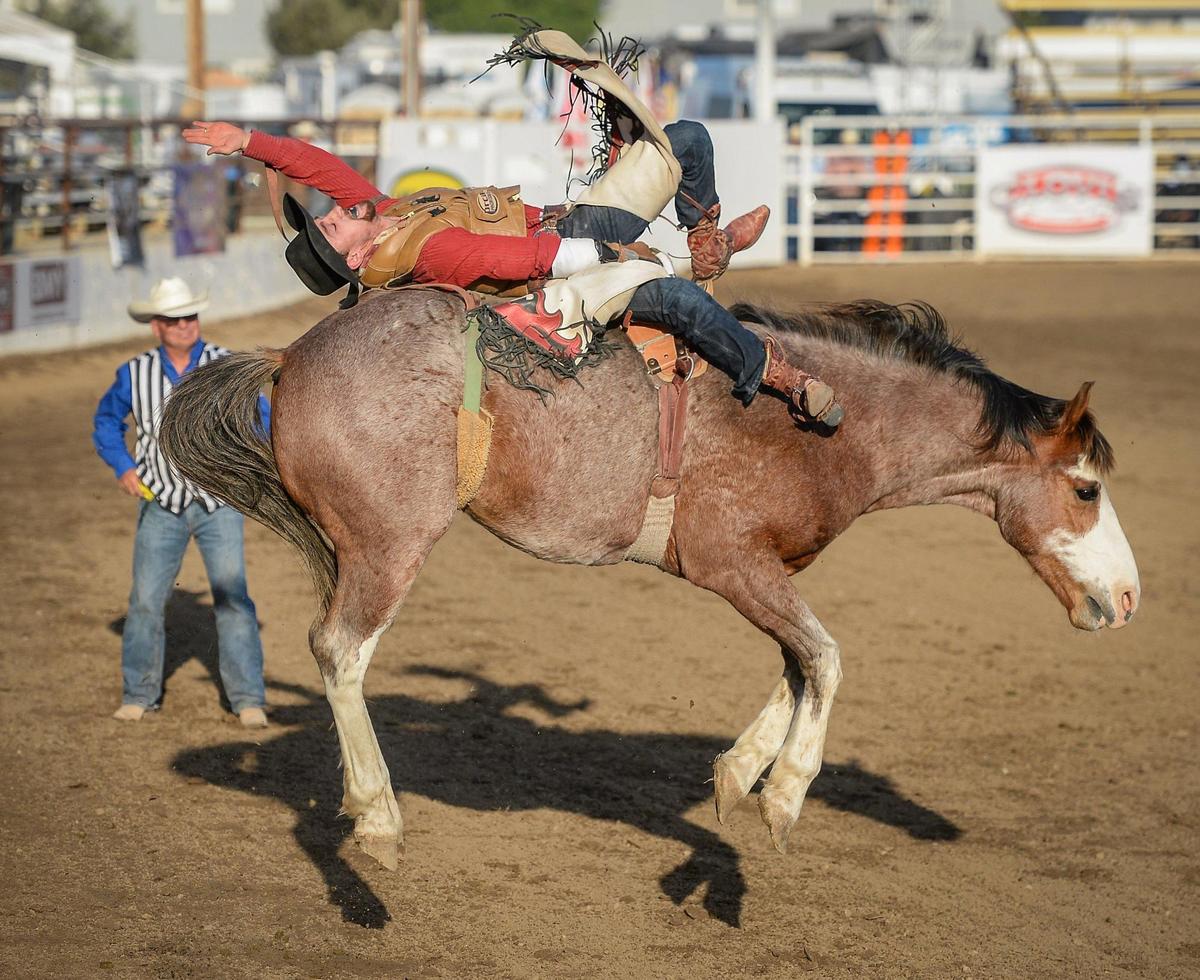 Garrett Shadbolt of Merriman, NE, rides Jericho in the bareback riding section of the PRCA event at the Clovis Rodeo on Thursday, April 23, 2021.