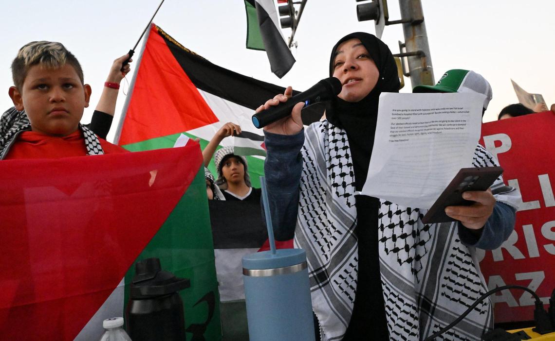 Israa Q. speaks as hundreds of Palestinian supporters rallied at Blackstone and Nees avenues to show support for Palestinians Tuesday evening, Oct. 17, 2023 in Fresno.