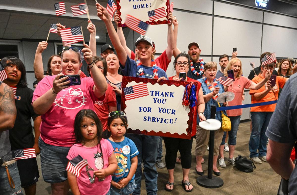 Hundreds wave and cheer as veterans from the Central Valley Honor Flight arrive back at Fresno Yosemite International Airport after touring U.S. Capital monuments and memorials on Wednesday, May 17, 2023.