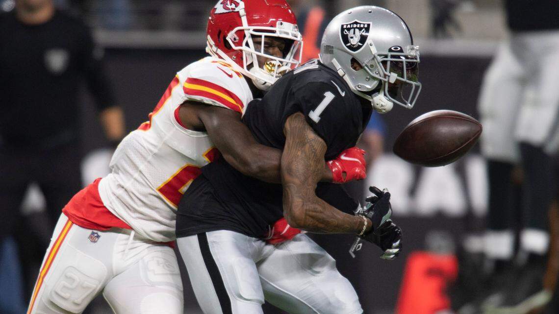 Kansas City Chiefs cornerback Rashad Fenton (27) causes Las Vegas Raiders wide receiver DeSean Jackson (1) to fumble the ball in the third quarter during an NFL game Sunday, Nov. 14, 2021, in Las Vegas.