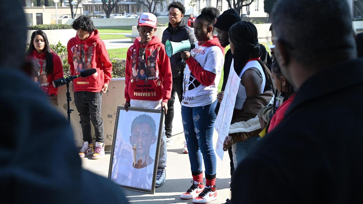 Rashad Al-Hakim Jr.’s mother Regina Bell, in center with bullhorn, speaks to those gathered at a rally demanding justice outside the Fresno County Courthouse Monday morning, Jan. 23. Bell’s son Rashad Al-Hakim Jr. was the 15-year old Hoover High School student killed in a hit-and-run Oct. 4, 2022.