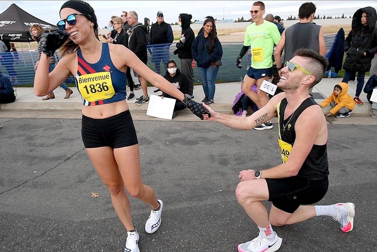 Monique Bienvenue of Los Angeles had a surprise waiting for her after crossing the finish in the half marathon: a marriage proposal from fiancé Samuel Mueller of Birmingham, Alabama. She said yes in front of fans Sunday, Nov. 7, 2021, at the Two Cities Marathon at Clovis Community College. Mueller also ran the half marathon.
