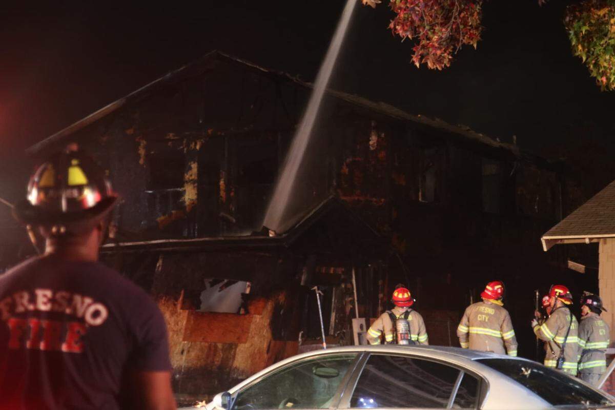Firefighters put out a fire at a vacant home in southeast Fresno on Friday, Nov. 23, 2018.