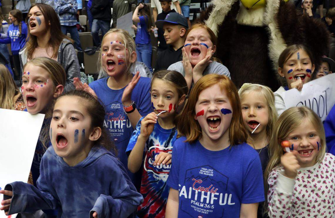 Young fans show their enthusiasm for Immanuel High moments before their team’s 41-29 win over Mendota High in the CIF Central Section Division IV championship game at Selland Arena on Feb. 23, 2024.