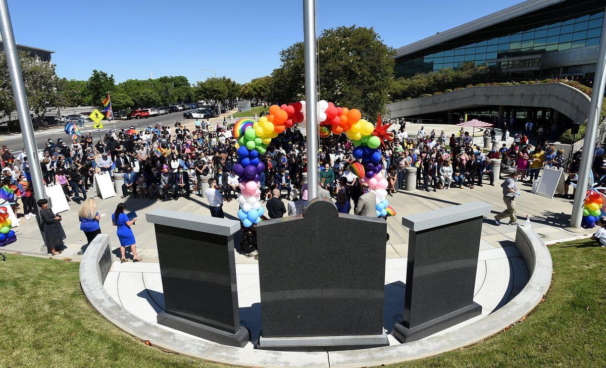 Crowds assemble before the raising of the LGBTQ+ Rainbow&nbsp;Pride flag over Fresno City Hall, Friday June 11, 2021.