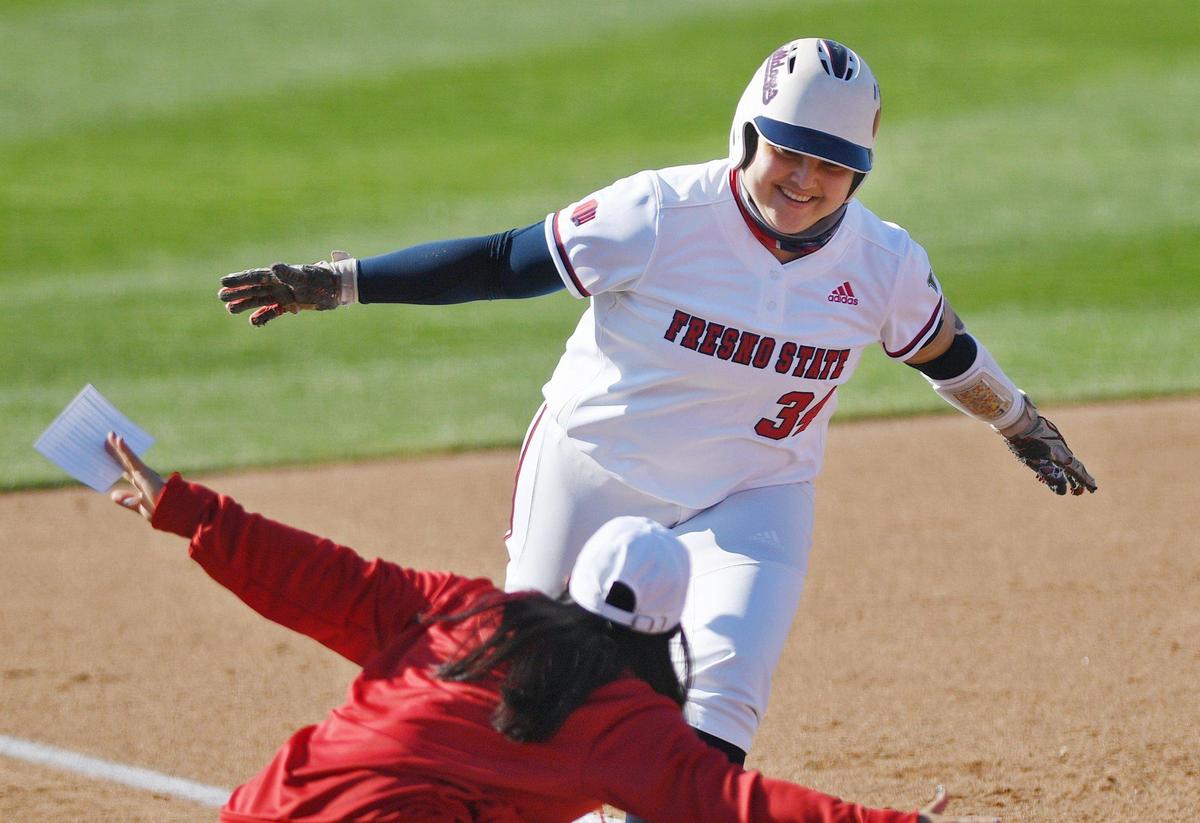 Fresno State’s Lexie Webb smiles as she rounds third after homering against Pacific in the first game of a doubleheader Friday afternoon, Feb. 19, 2021, at Margie Wright Diamond in Fresno. The game was called in the fifth inning with Fresno State leading 9-0.