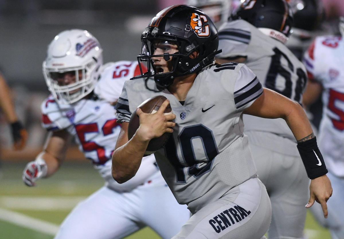 Central’s quarterback Dayton Tafoya scrambles for a run against Buchanan Friday, Oct. 7, 2022 in Fresno. Buchanan won 49-41.