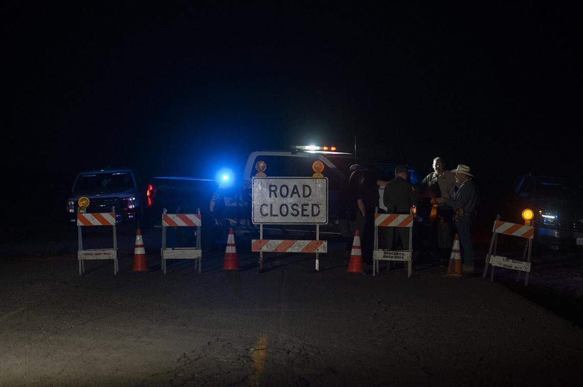 Authorities close a section of Indiana Road as they investigate after the bodies of four kidnapped victims in a rural area north of Dos Palos in Merced County, Calif., on Wednesday, Oct. 5, 2022.
