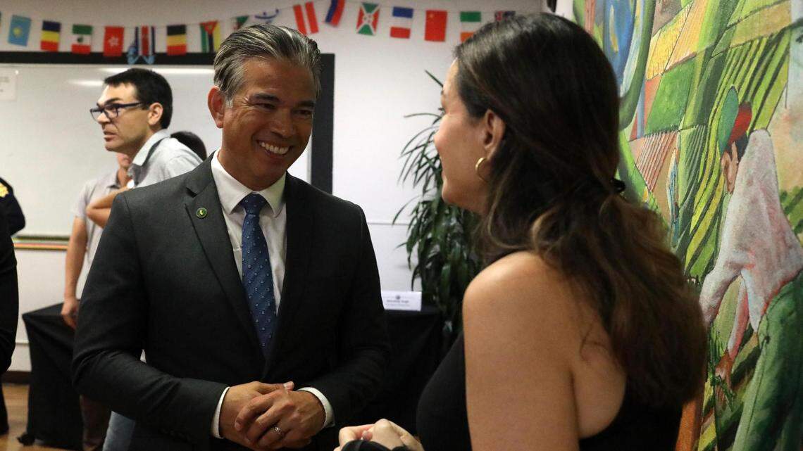 California Attorney General Rob Bonta talks with April Taylor-Salery, Trans-E-Motion board member after the roundtable on hate crimes hosted by Bonta.