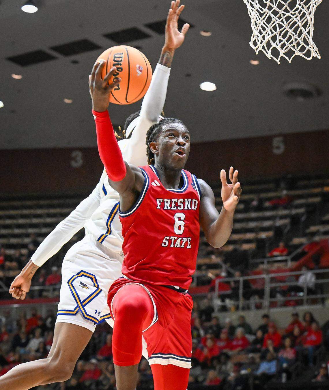 Fresno State's DJ Stickman goes for a layup against CSU Bakersfield during their non-conference game at Selland Arena in downtown Fresno for the “Return to Selland” game on Sunday, Nov. 30, 2025.