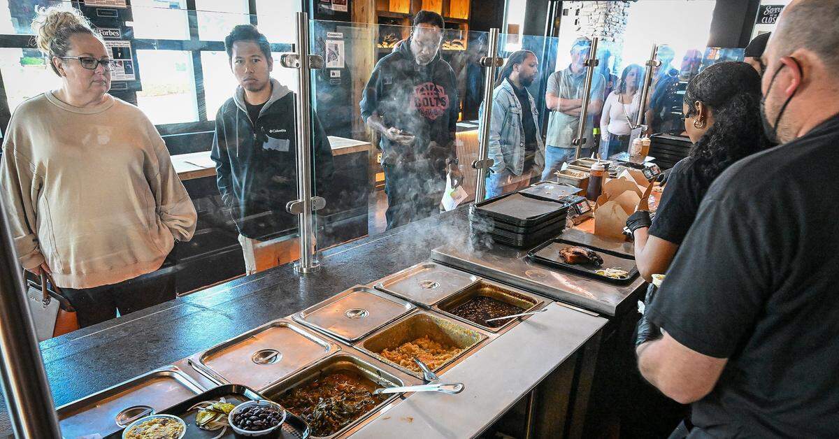 Lunchtime visitors wait in line at the counter while making their orders at Horn Barbecue in Fresno's Granite Park shopping center on Friday, Jan. 23, 2026. The long-anticipated barbecue restaurant opened on Tuesday, Jan. 20.