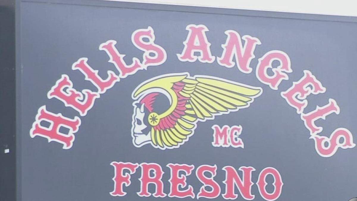 The Winged Death’s Head  of the Hells Angels stood above the entrance to the outlaw club on South G Street.